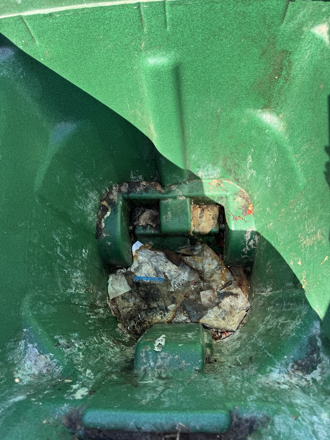 Green bin interior before cleaning